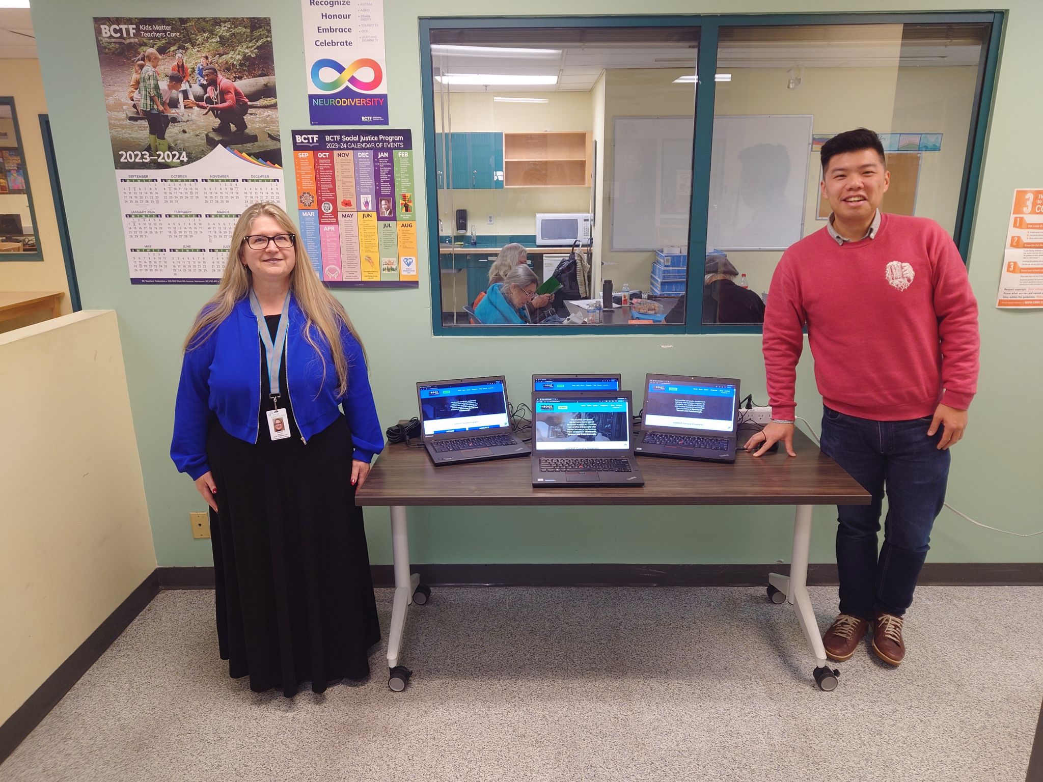 Marnie from the Gathering Place Community Centre in downtown Vancouver poses with Steve Lee and some of the laptops reBOOT Canada provided for use by the Gathering Place's clients.